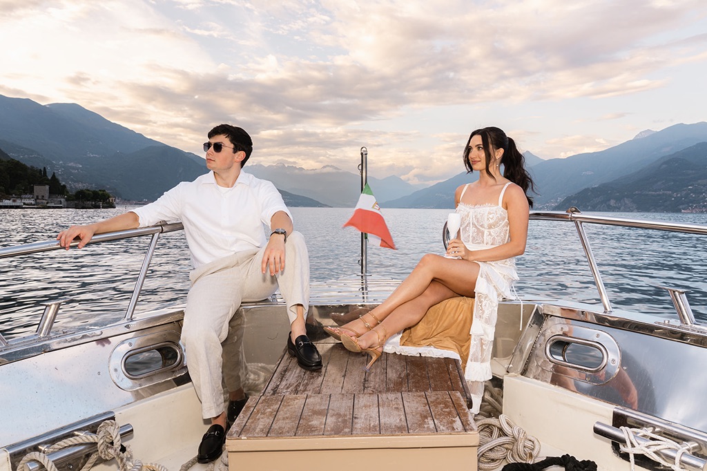 a couple on their welcome's party boat in lake como